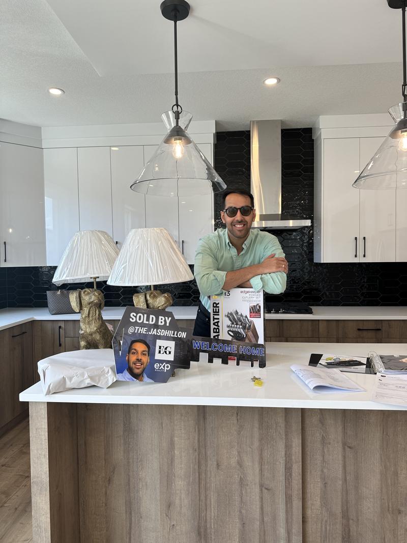 Jaskaran at a kitchen island on possession day